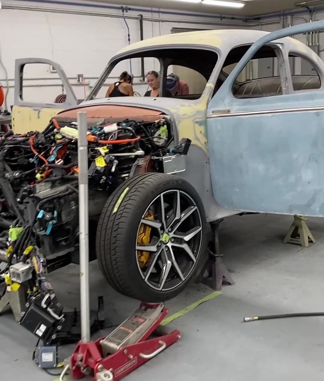 The two cars have become one! The body of the 1961 Volvo PV544 is now welded to the chassis-frame of a new 2019 Volvo S60 T8 Polestar Engineered sedan. (Image courtesy PADT Inc.)