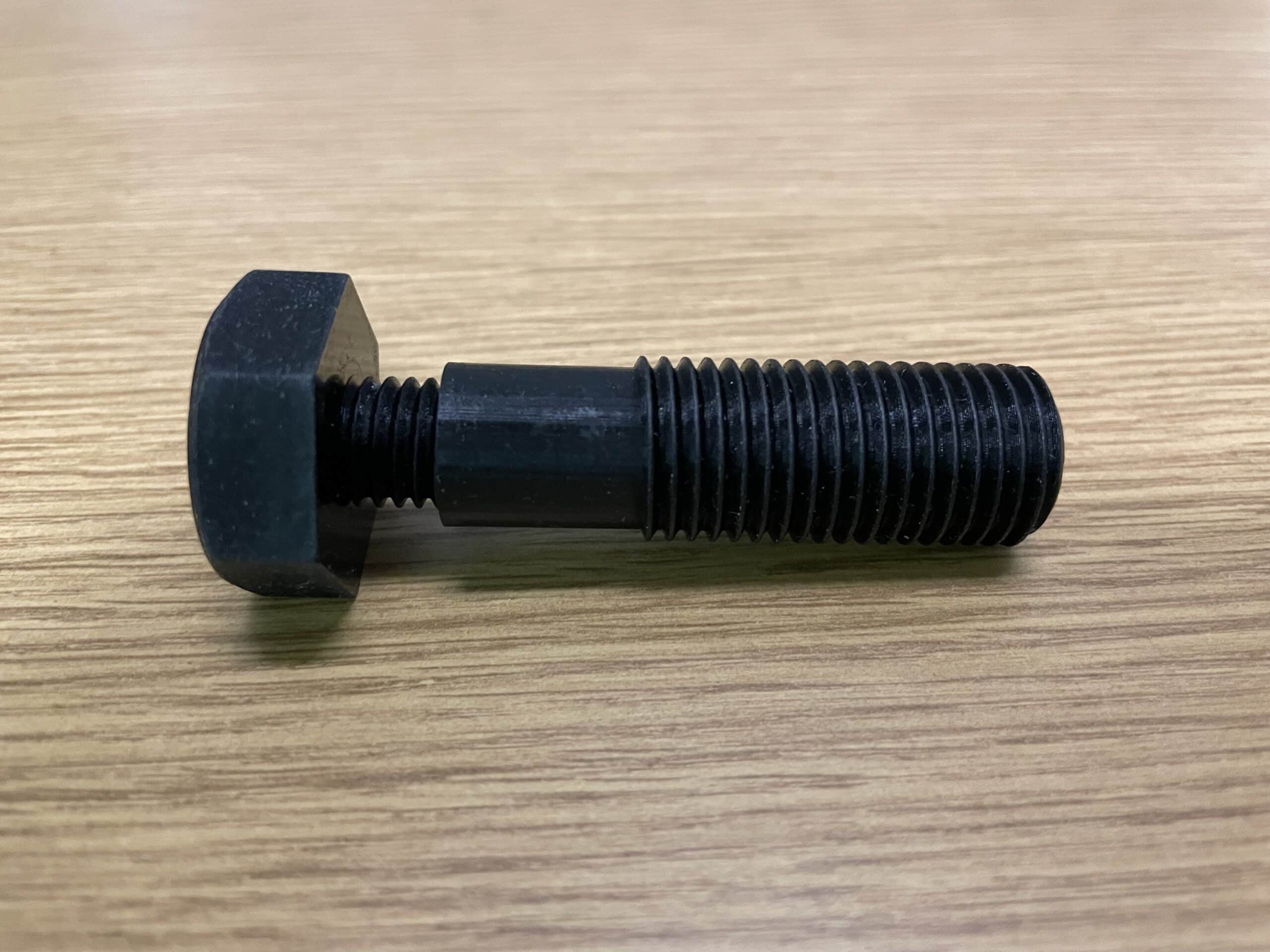 The bolt is actually a two-piece assembly: there is a reverse-threaded sleeve. (Image courtesy PADT Inc.)