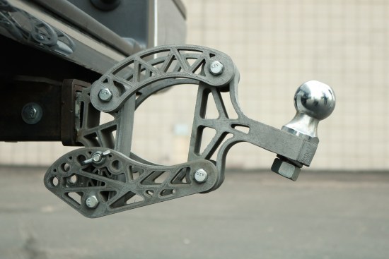 An adjustable-height "topology optimized" trailer hitch Austin designed and printed in ABS. The chrome paint-job has many passersby doing a double-take, but it's just for fun, not function. (Image courtesy PADT)