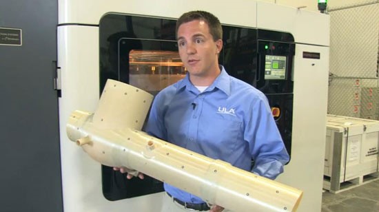 ULA's Kyle Whitlow demonstrates the ECS duct that was printed using FDM