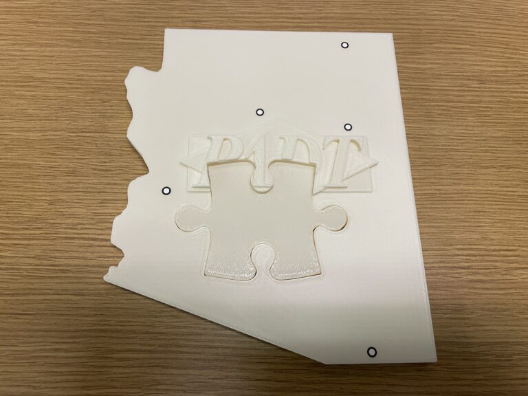 3D Printed puzzle including printed replacement piece created by 3D scanning.